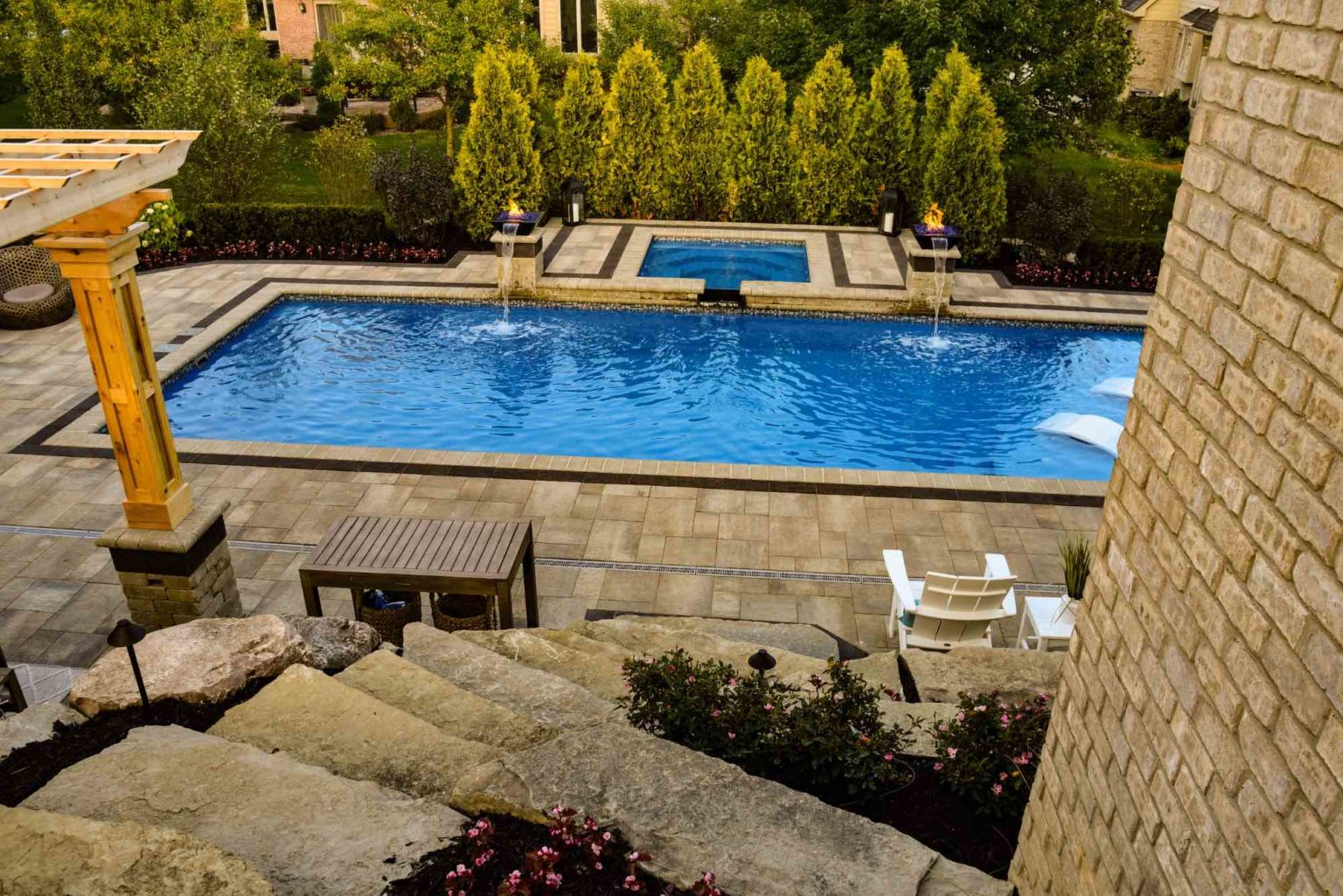 Arborvitae privacy trees  fiberglass pool and spa design Michigan Pavers Paver Installation Michigan Paver Contractors in Michigan Best Pavers in Michigan Michigan Patio Pavers Driveway Pavers Michigan Walkway Pavers Michigan Michigan Paver Stones Custom Pavers Michigan