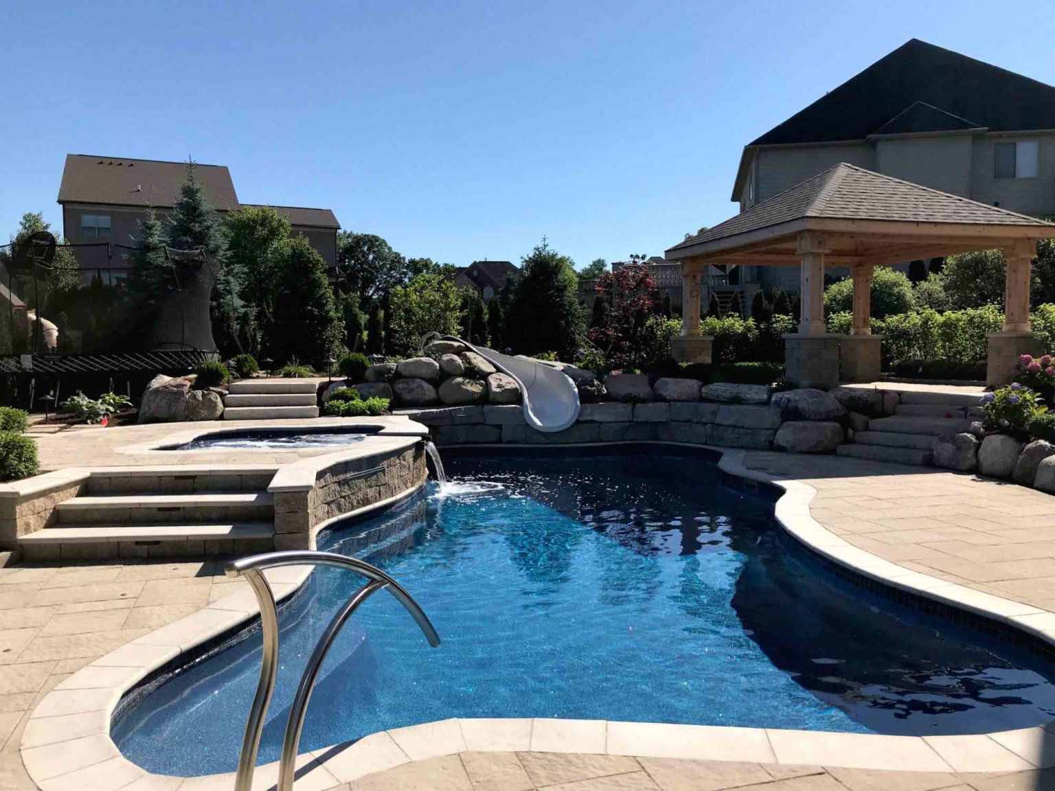 Custom fiberglass pools Rochester hills michigan Michigan Landscape Design Landscape Design Services in Michigan Professional Landscape Design Michigan Michigan Landscape Architects Best Landscape Designers in Michigan Michigan Residential Landscape Design Custom Landscape Design Michigan Michigan Garden Design Landscape Planning Michigan Landscape Installation Michigan Michigan Landscape Renovation Michigan spa design, spillover spa design, spillover spa inspo, landscape design, michigan pool design, paving company in Michigan, inground pool, pool inspo, backyard pool, pavers, pavers near me, swim and spa, swimming pool design and install, backyard ideas, privacy fence ideas, backyard landscaping ideas, unilock