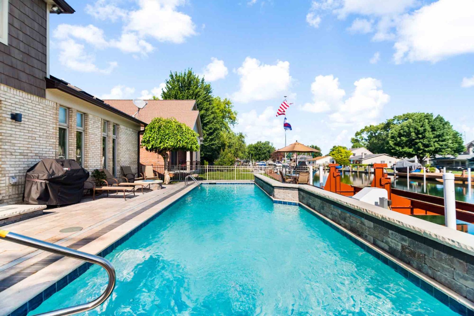 gunite pool builders Harrison twp Unilock pool deck design nterlocking Pavers Michigan Concrete Pavers Michigan Brick Pavers Michigan Natural Stone Pavers Michigan Michigan Paver Patio Ideas Custom inground pools