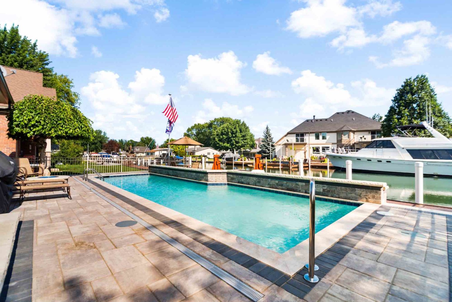 gunite pool builders Harrison twp Unilock pool deck design Michigan Pavers Paver Installation Michigan Paver Contractors in Michigan Best Pavers in Michigan