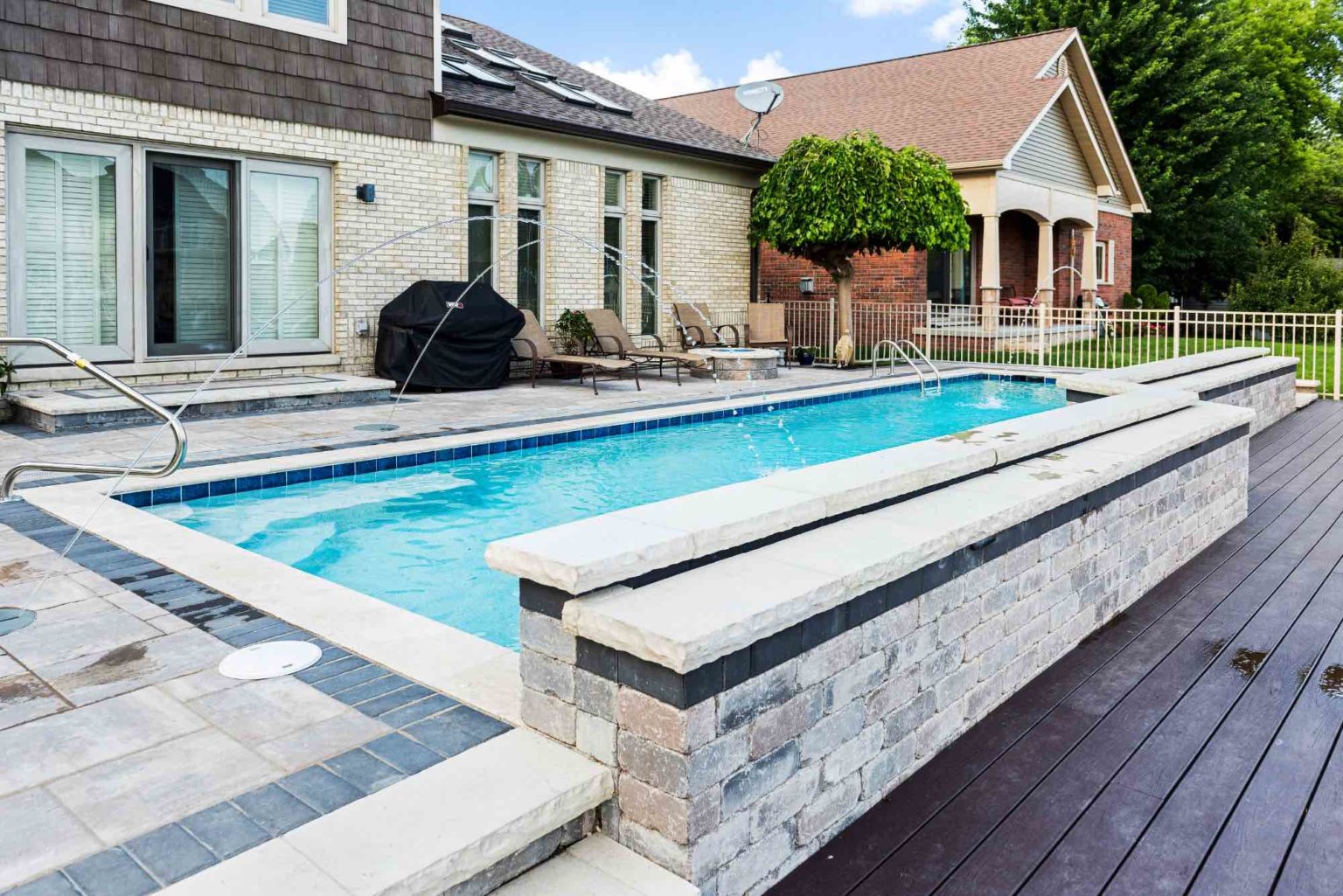 luxury custom gunite swimming pool with jet fountains and sheet fountains Michigan Landscape Design Landscape Design Services in Michigan Professional Landscape Design Michigan Michigan Landscape Architects Best Landscape Designers in Michigan Michigan Residential Landscape Design Custom Landscape Design Michigan Michigan Garden Design Landscape Planning Michigan Landscape Installation Michigan