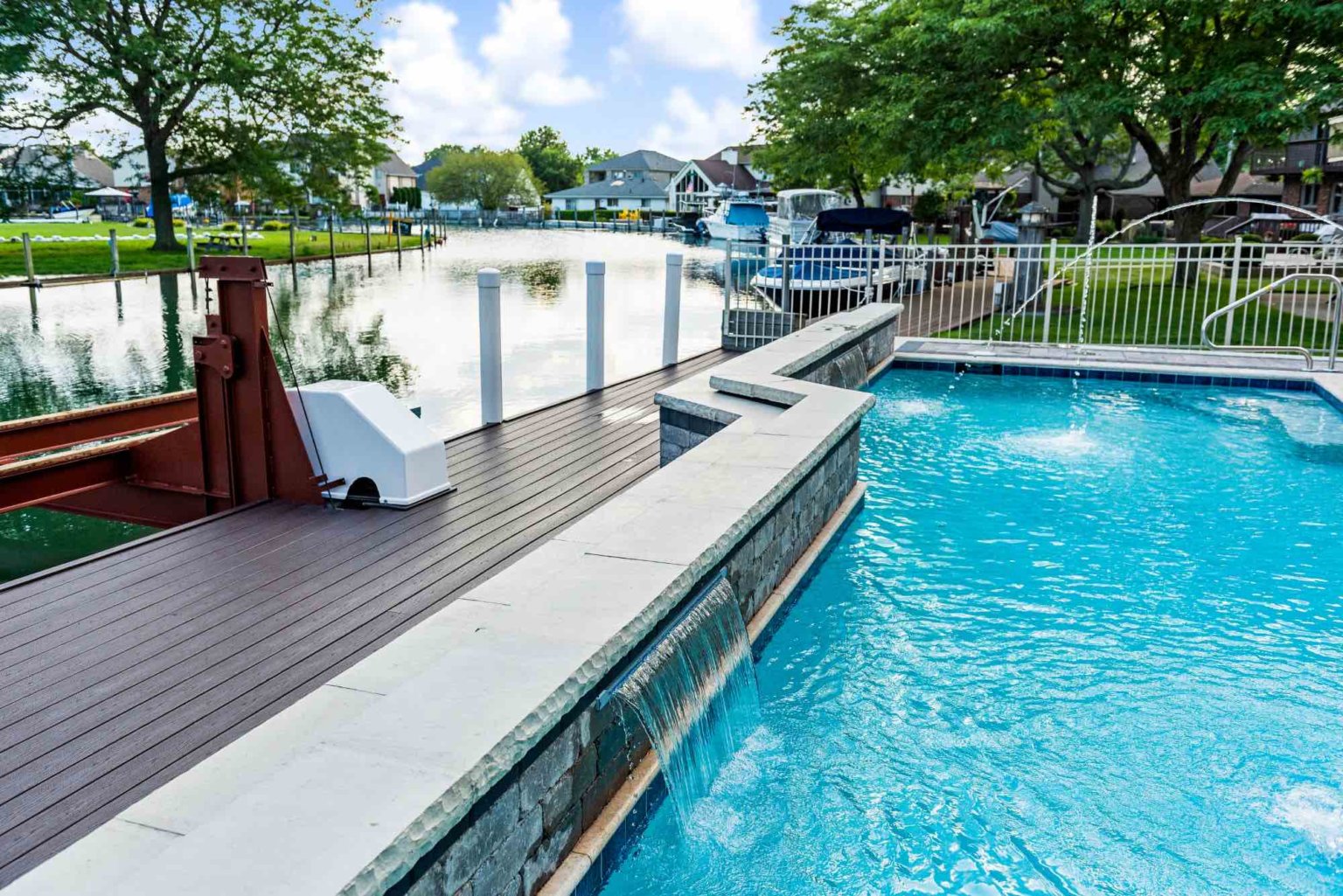 Unilock pool deck design Custom inground pools pool fountains michigan cascading fountain designers