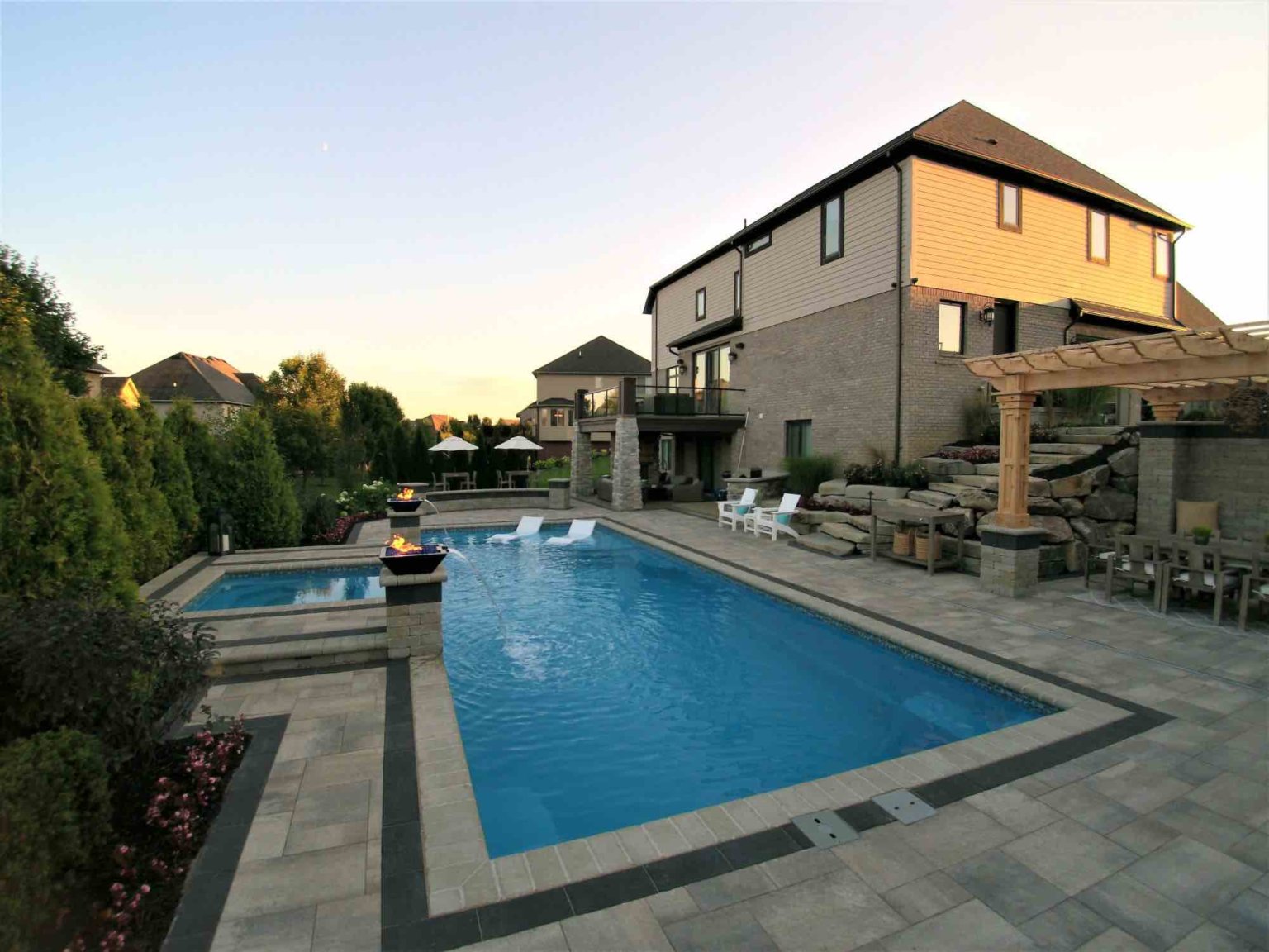 fiberglass pool designers in Shelby Twp, Mi landscape design project in Shelby Township cascade fiberglass swimming pool design with a raised spillover spa  Michigan Landscape Design Landscape Design Services in Michigan Professional Landscape Design Michigan Michigan Landscape Architects Best Landscape Designers in Michigan