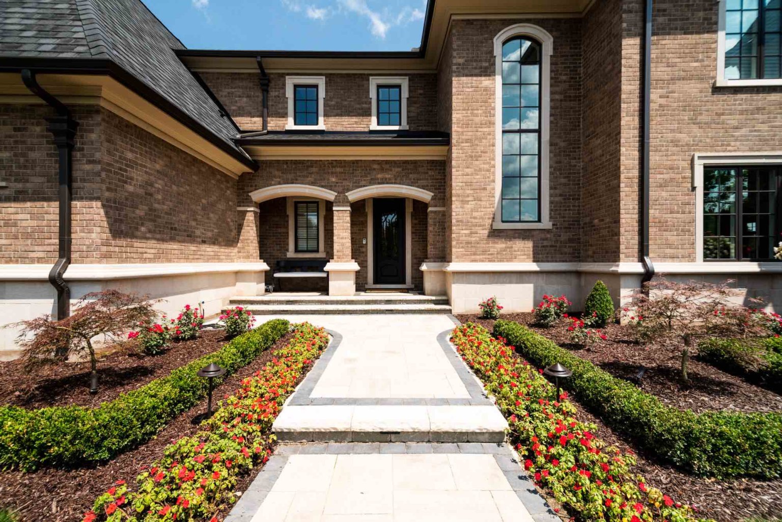 front yard design, landscape design, garden design, patio pavers, front yard ideas, house goals, landscape architecture, garden design, outdoor lighting, landscape lighting, low voltage landscape lighting, yard lights, pathway lighting, pavers, patio pavers, pavers near me, boxwood hedges, mulching near me, retaining walls, XL Pavers, modern design, contemporary home inspo, stepping stones