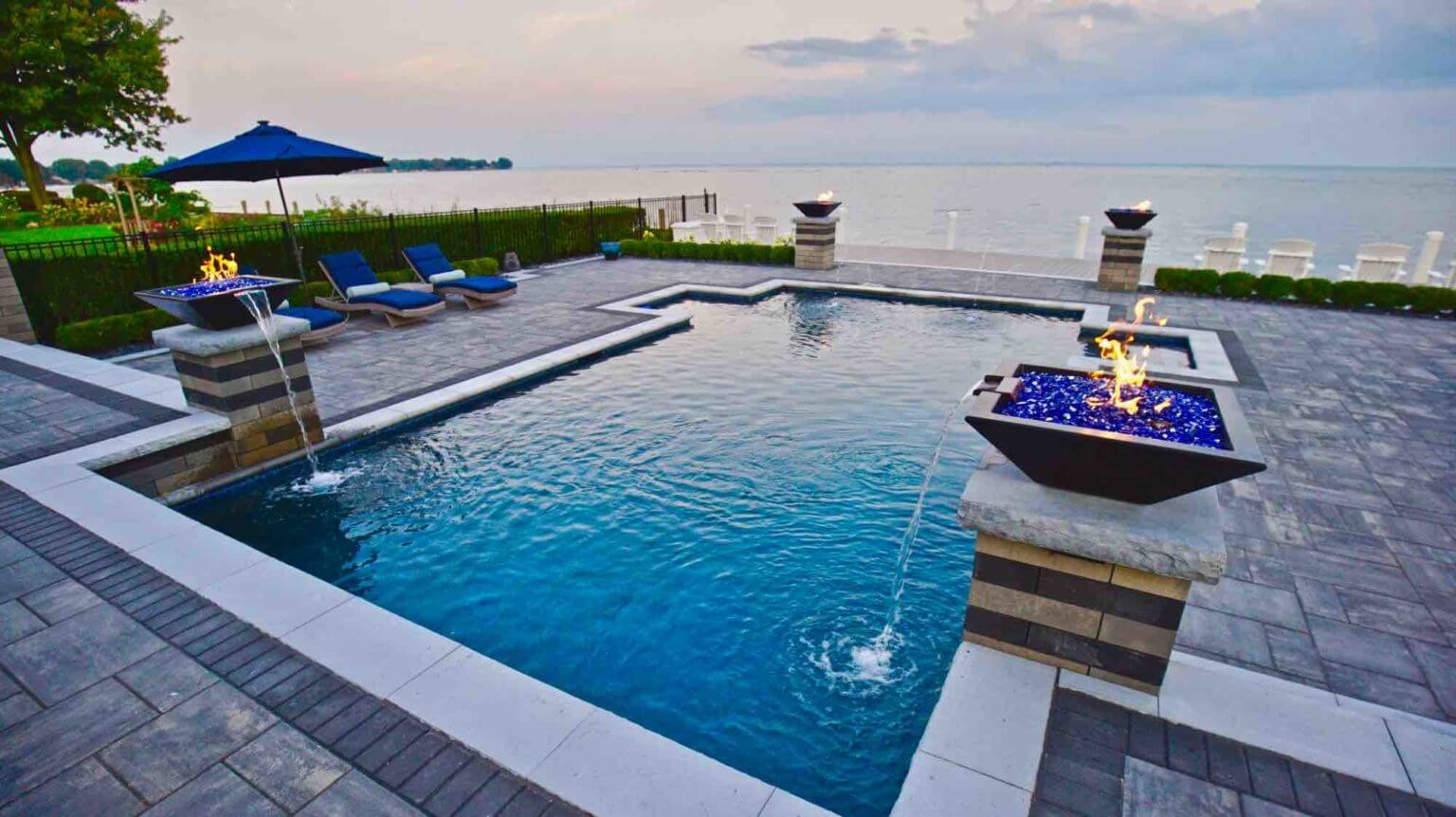 lakeside pool and lakefront patio gunite inground pool builders in Chesterfield Township Michigan pool and spa design Metro Detroit Metro Detroit pool and spa experts Custom pool design Metro Detroit Spa installation in Metro Detroit Metro Detroit outdoor spa design Residential pool design Metro Detroit Metro Detroit luxury pool and spa Pool and spa renovation Metro Detroit Metro Detroit backyard pool design Metro Detroit pool and spa builders Metro Detroit pool and spa contractors Custom inground pools Backyard pool ideas detroit Outdoor living contractor oak