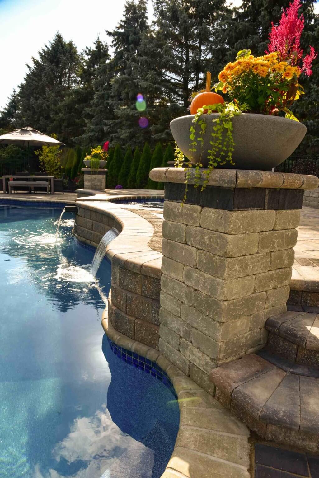 poolside masonry details fiberglass pool and spillover spa in Washington Twp, Michigan