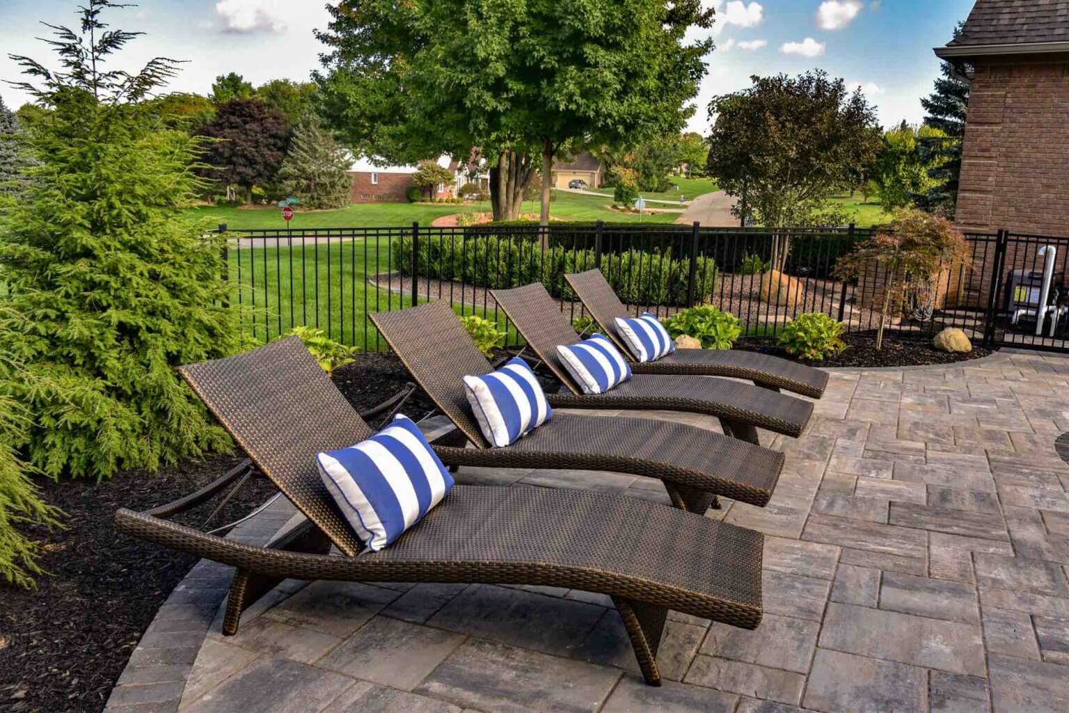 deck chairs by pool Michigan Landscape Design Landscape Design Services in Michigan Professional Landscape Design Michigan Michigan Landscape Architects Best Landscape Designers in Michigan Michigan Residential Landscape Design Custom Landscape Design Michigan