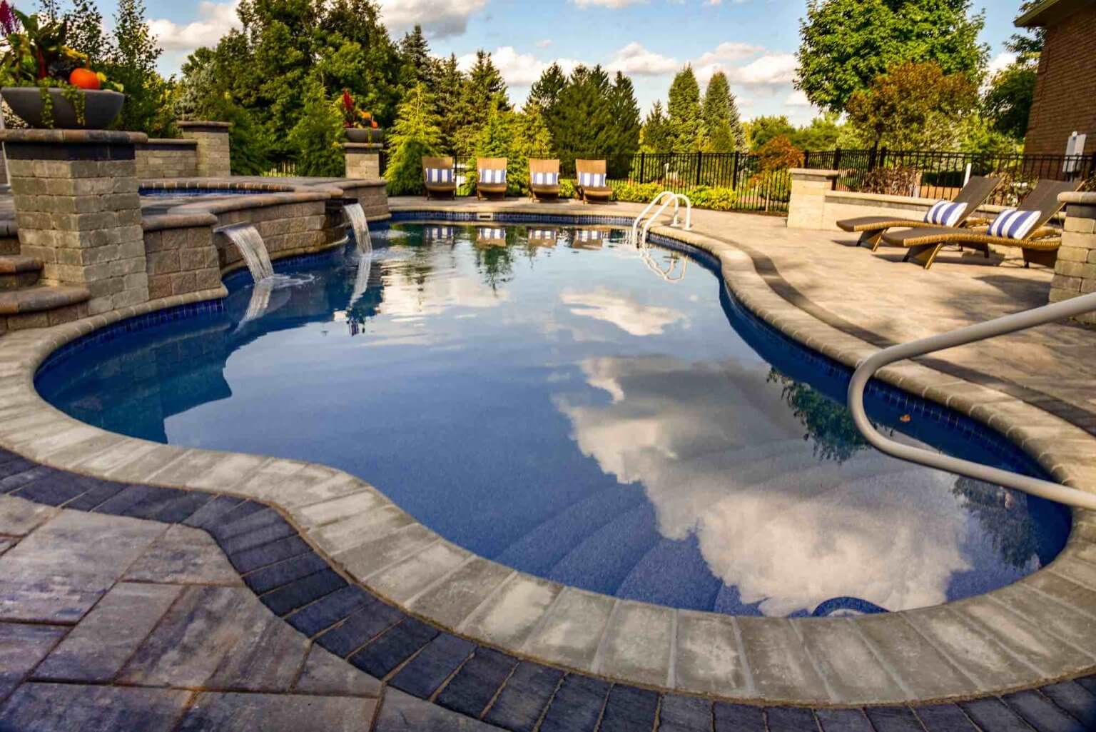 pool with hot tub spillover fiberglass pool and spillover spa in Washington Twp, Michigan Michigan Pavers Paver Installation Michigan Paver Contractors in Michigan Best Pavers in Michigan Michigan Patio Pavers Driveway Pavers Michigan Walkway Pavers Michigan Michigan Paver Stones Custom Pavers Michigan Michigan Paver Design pool and spa design Metro Detroit Metro Detroit pool and spa experts Custom pool design Metro Detroit Spa installation in Metro Detroit Metro Detroit outdoor spa design Residential pool design Metro Detroit Metro Detroit luxury pool and spa