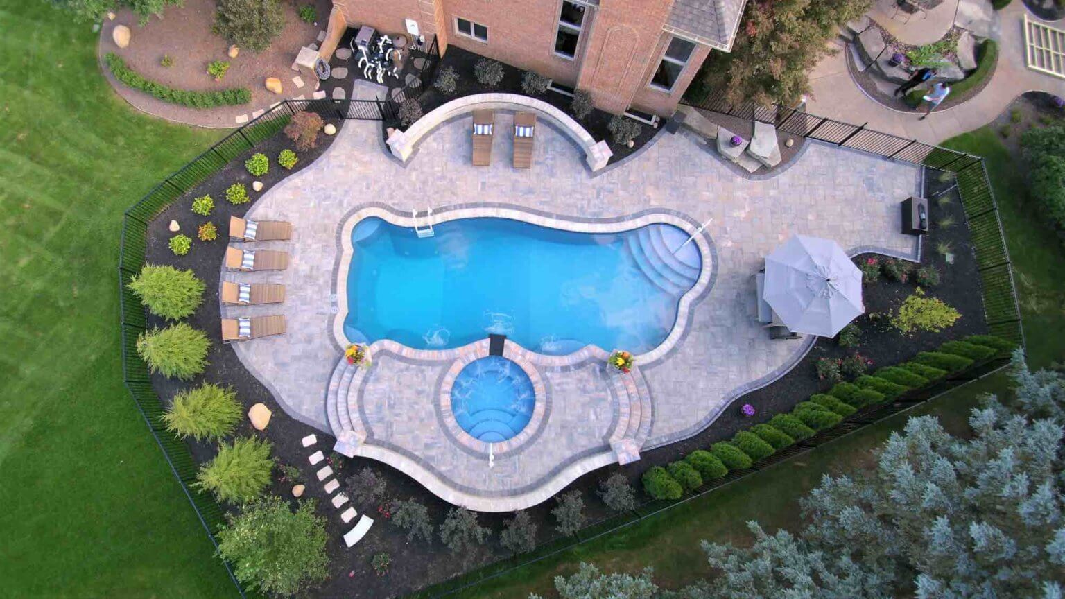 aerial view of pool & hot tub Custom inground pools Backyard pool ideas detroit Michigan Landscape Design Landscape Design Services in Michigan Professional Landscape Design Michigan Michigan Landscape Architects Best Landscape Designers in Michigan Michigan Residential Landscape Design Custom Landscape Design Michigan Michigan Pavers Paver Installation Michigan Paver Contractors in Michigan Best Pavers in Michigan Michigan Patio Pavers Driveway Pavers Michigan Walkway Pavers Michigan Michigan Paver Stones Custom Pavers Michigan Michigan Paver Design pool and spa design Metro Detroit Metro Detroit pool and spa experts Custom pool design Metro Detroit Spa installation in Metro Detroit Metro Detroit outdoor spa design Residential pool design Metro Detroit Metro Detroit luxury pool and spa