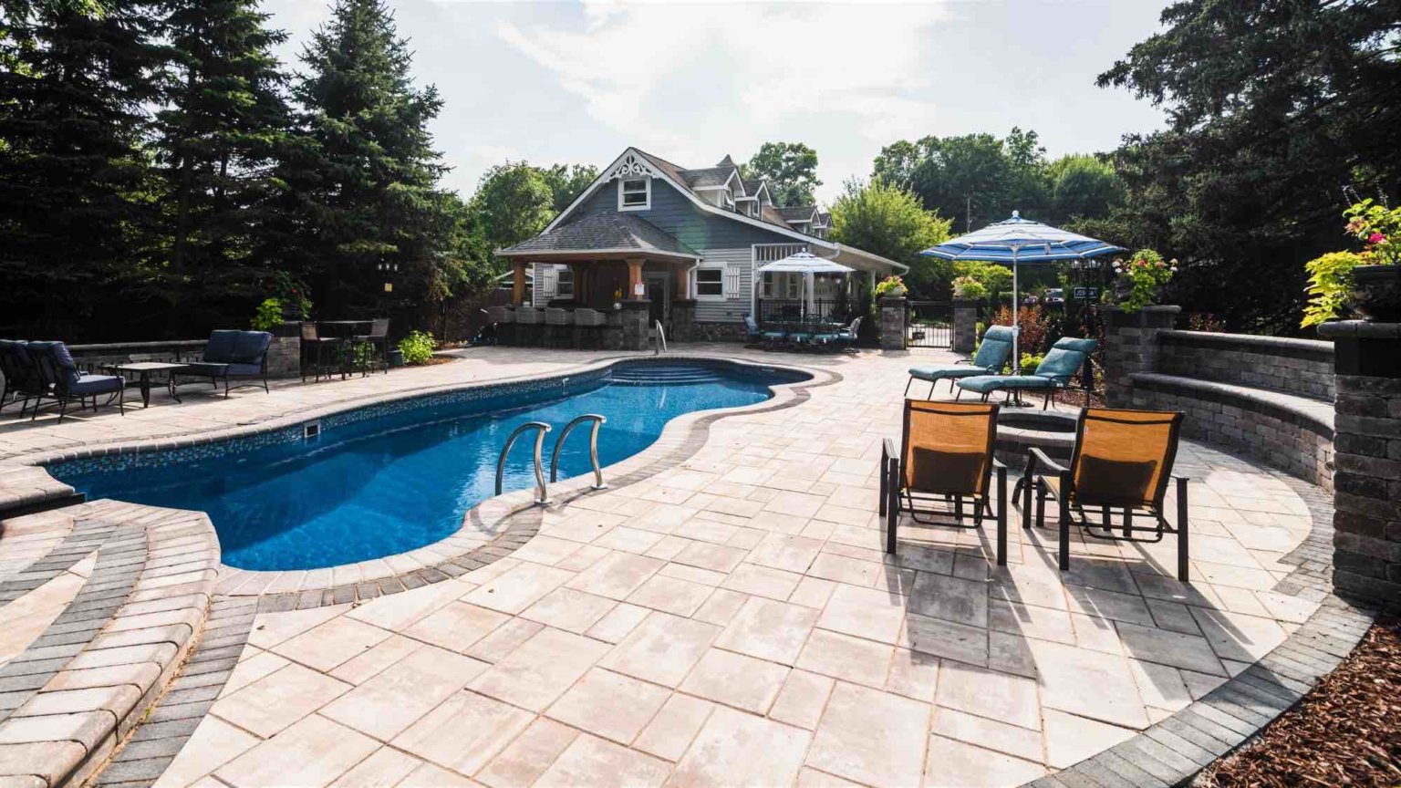 backyard poolside lounge fiberglass pool and spillover spa Landscape se michigan Hardscape Clinton twp mi Patio designs Clinton twp mi Michigan Pavers Paver Installation Michigan Paver Contractors in Michigan Best Pavers in Michigan Michigan Patio Pavers Driveway Pavers Michigan Walkway Pavers Michigan