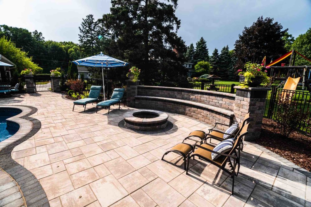 poolside firepit Landscape se michigan Hardscape Clinton twp mi Patio designs Clinton twp mi Outdoor Fire Features Fire Pit Designs Fire Feature Ideas Gas Fire Pits Outdoor Fireplaces Fire Pit Installation Custom Fire Features Natural Stone Pavers Michigan Michigan Paver Patio Ideas