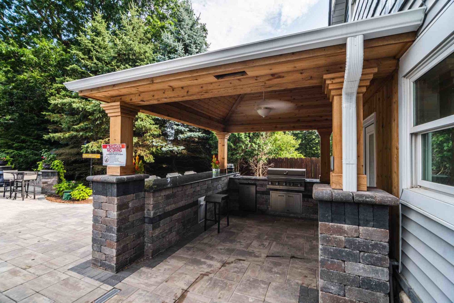 outdoor kitchen next to pool Outdoor kitchens Clinton twp mi outdoor kitchen se michigan Pool House Designs Pool House Plans Custom Pool House Construction Pool House Ideas