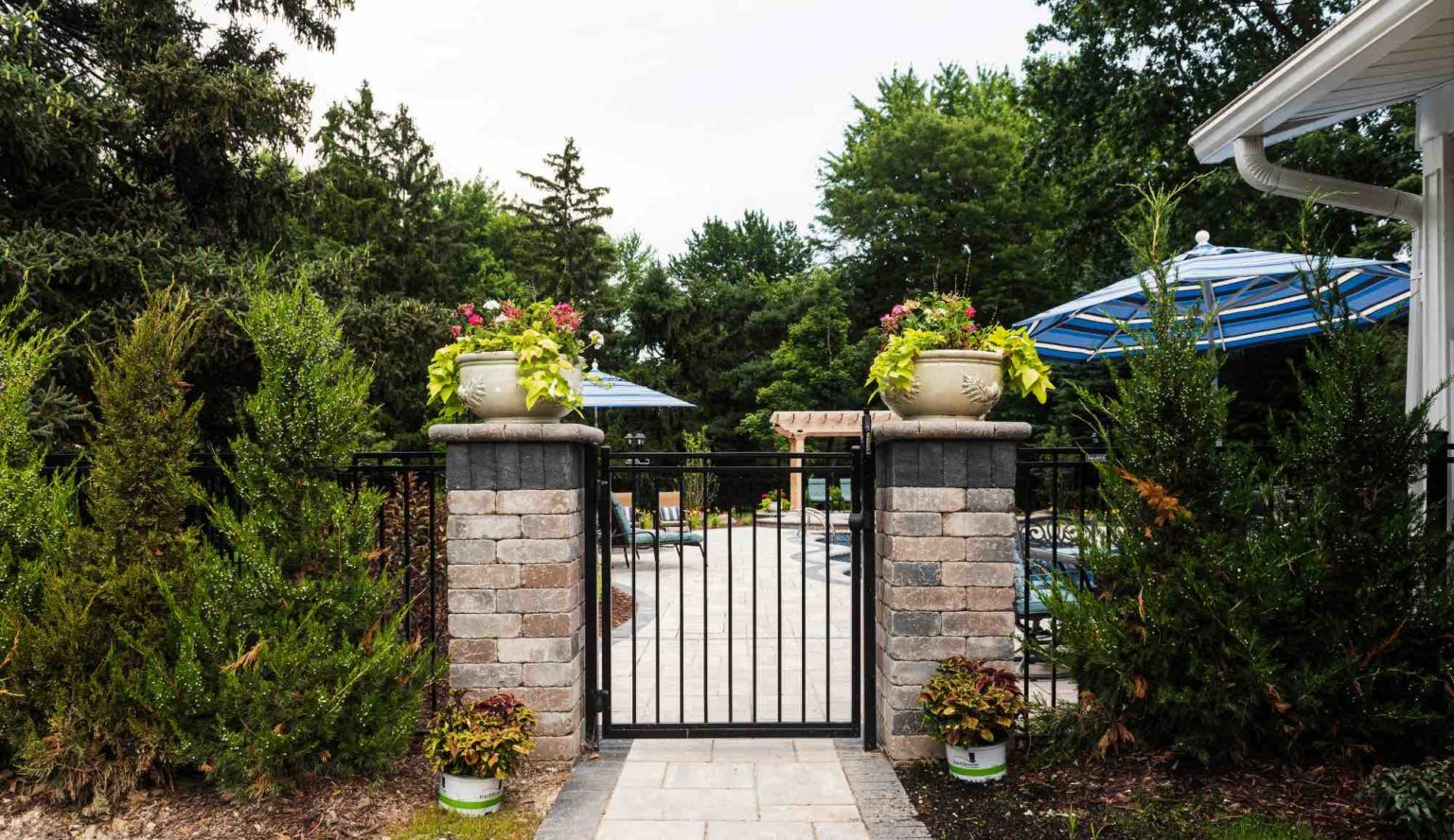 entry gate into poolside lounge Landscape se michigan Hardscape Clinton twp mi Patio designs Clinton twp mi Michigan Pavers Paver Installation Michigan Paver Contractors in Michigan Best Pavers in Michigan Michigan Patio Pavers Driveway Pavers Michigan Walkway Pavers Michigan