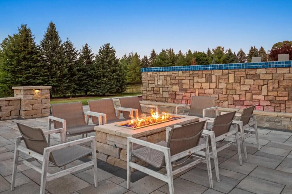 Livin On The Edge - Oakland Township, MI Michigan Hardscape Design Award-Winning Landscape Design Michigan Michigan Four-Season Landscape Design Outdoor Fire Features Fire Pit Designs Fire Feature Ideas Gas Fire Pits Outdoor Fireplaces Fire Pit Installation Custom Fire Features Backyard Fire Features Fire Pit Safety Fire Feature Accessories Fire Feature Landscaping