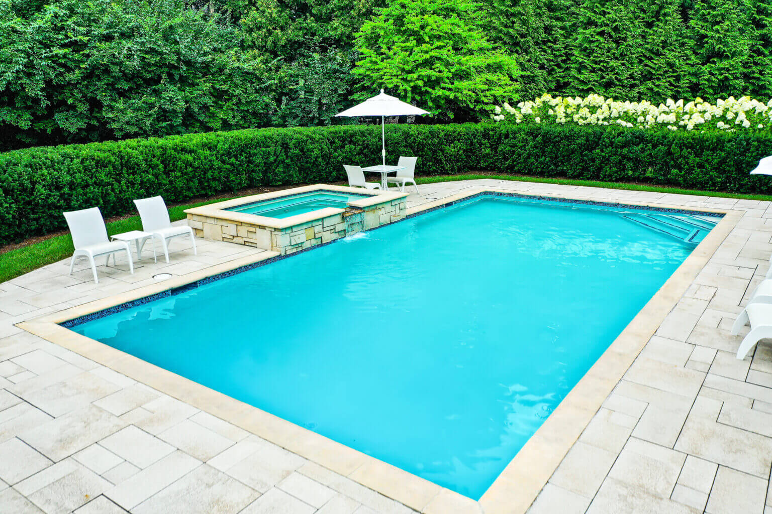 landscape design, michigan pool design, paving company in Michigan, inground pool, pool inspo, backyard pool, pavers, pavers near me, swim and spa, swimming pool design and install, backyard ideas, privacy fence ideas, backyard landscaping ideas, inground pool ideas, gunite pools, unilock brick paving in Bloomfield