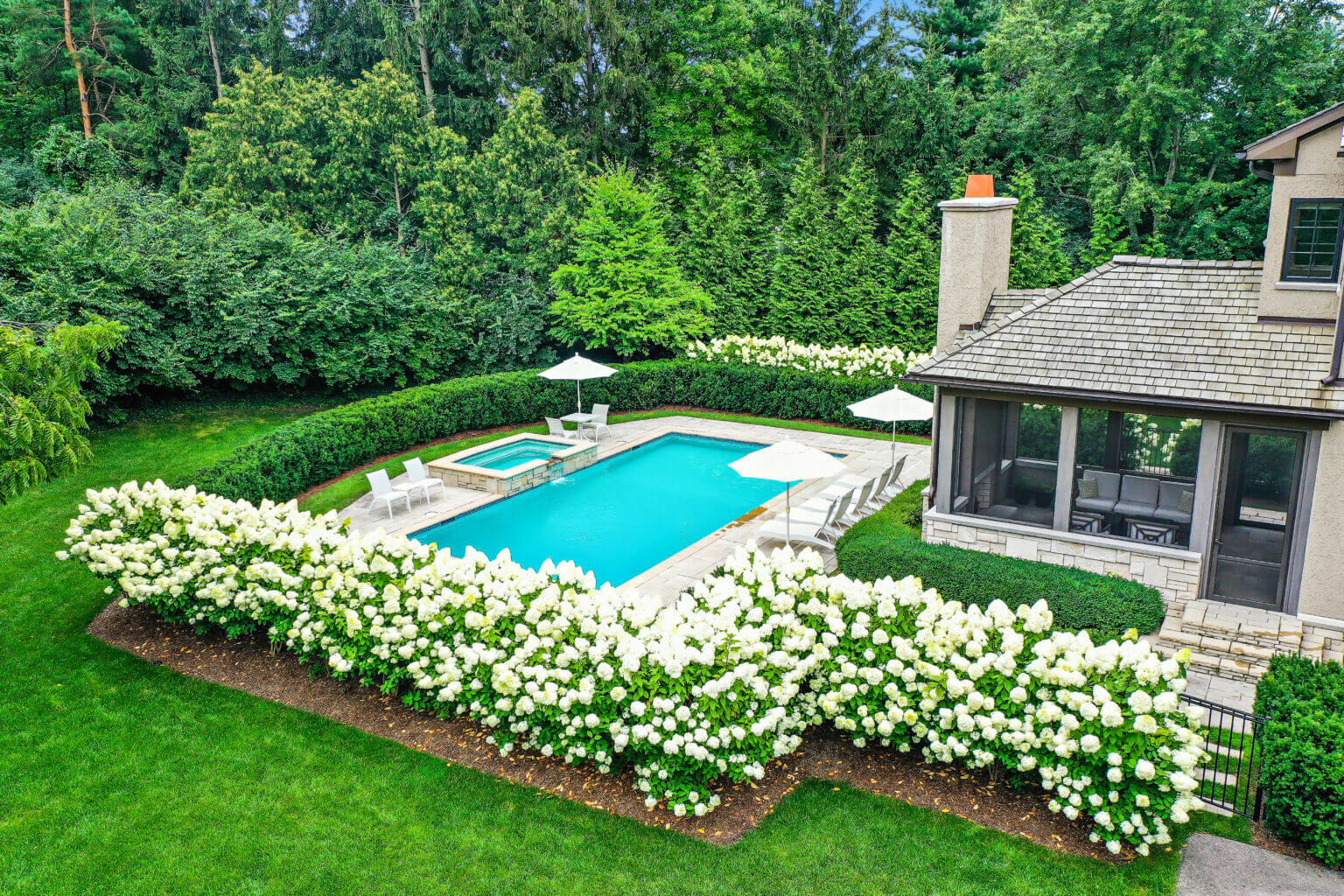 landscape design, michigan pool design, paving company in Michigan, inground pool, pool inspo, backyard pool, pavers, pavers near me, swim and spa, swimming pool design and install, backyard ideas, privacy fence ideas, backyard landscaping ideas, privacy plants, unilock brick paving in Bloomfield
