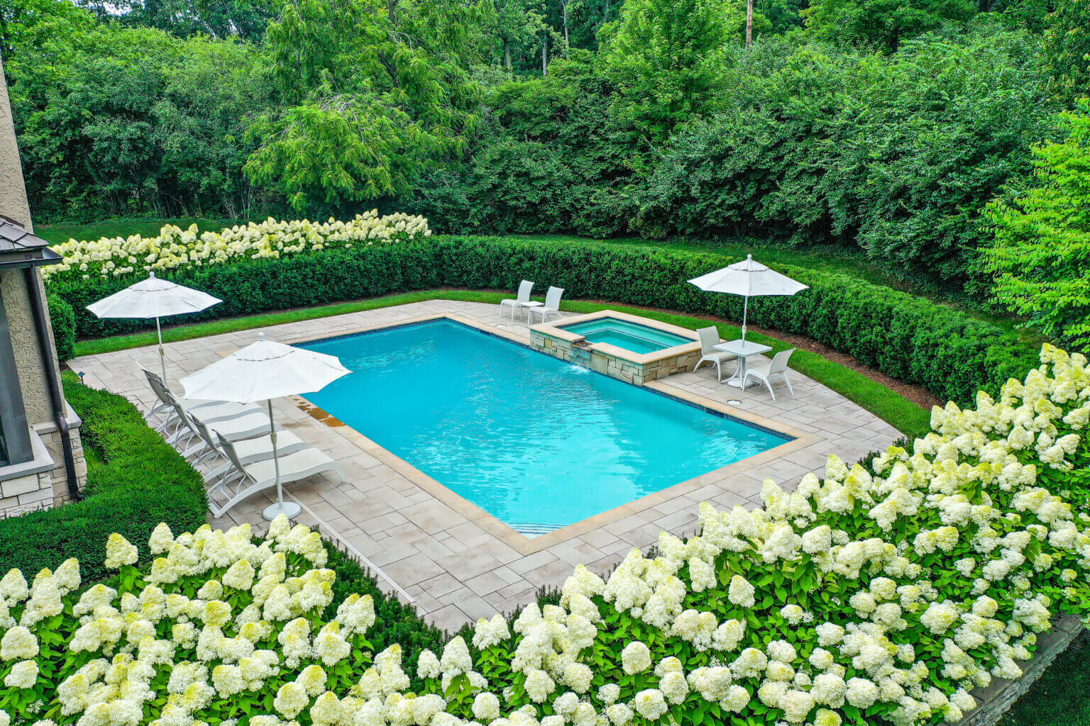 landscape design, michigan pool design, paving company in Michigan, inground pool, pool inspo, backyard pool, pavers, pavers near me, swim and spa, swimming pool design and install, backyard ideas, privacy fence ideas, backyard landscaping ideas, stone paving, pool paving, unilock brick paving in Bloomfield pool designers near me patio designs with pool, custom inground pools professional pool design & installation