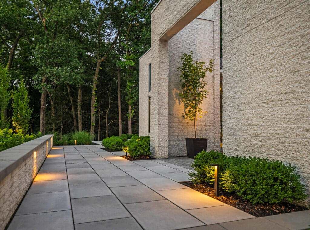 front yard design, landscape design, garden design, patio pavers, front yard ideas, house goals, landscape architecture, garden design, outdoor lighting, landscape lighting, low voltage landscape lighting, yard lights, pathway lighting, pavers, patio pavers, pavers near me, boxwood hedges, mulching near me, retaining walls, XL Pavers, modern design, contemporary home inspo, stepping stones