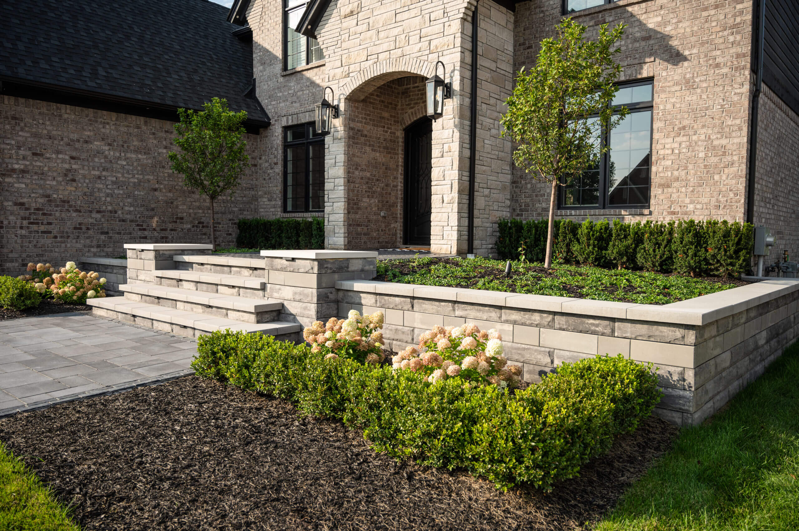 Front yard walkway pavers Michigan Front yard paver installation in Michigan Michigan front yard brick pavers Front yard driveway pavers Michigan Michigan front yard paver contractors Front yard paving ideas in Michigan Michigan front yard outdoor living with pavers