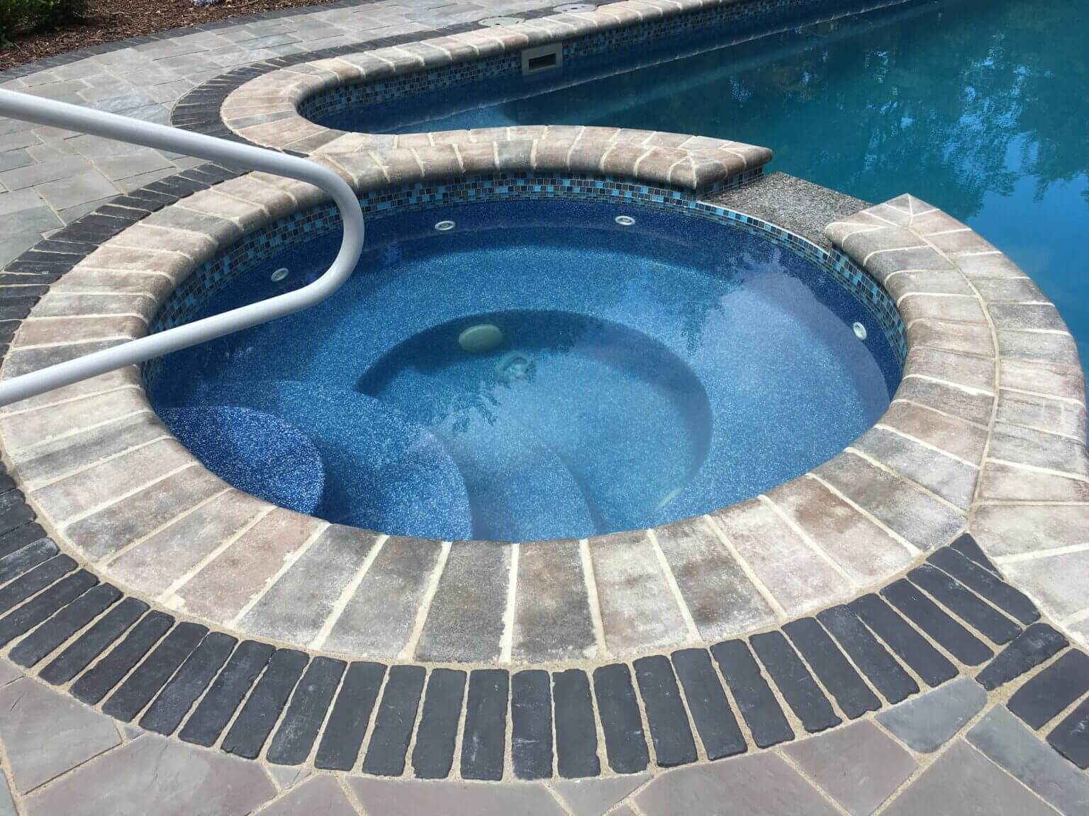 Brick pavers rochester mi custom brick landscaping rochester mi custom patio paving rochester mi pool and spa design Metro Detroit Metro Detroit pool and spa experts Custom pool design Metro Detroit Spa installation in Metro Detroit