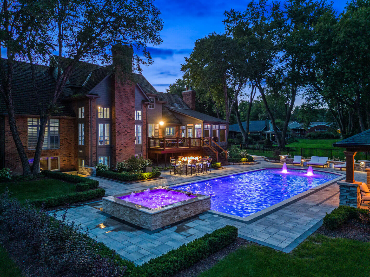 Michigan spa design, spillover spa design, spillover spa inspo, landscape design, michigan pool design, paving company in Michigan, inground pool, pool inspo, backyard pool, pavers, pavers near me, Gunite Pool Construction Custom Gunite Pool Designs Gunite Pool Installation