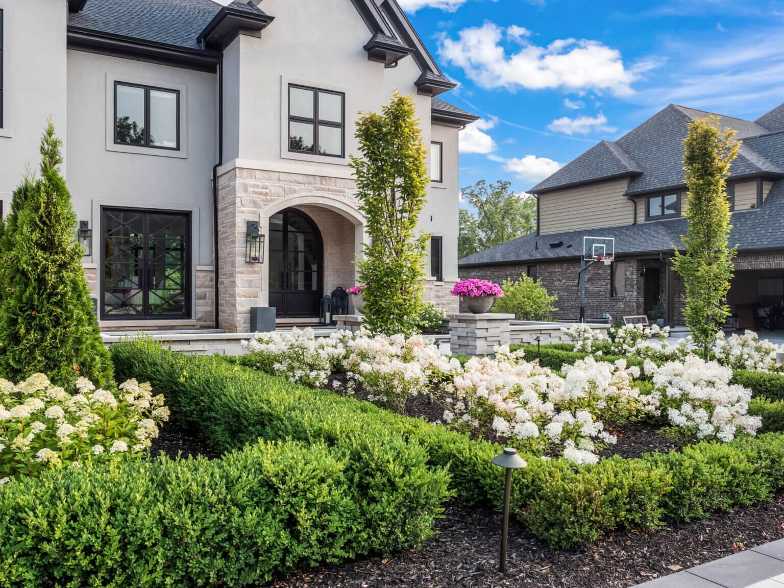 Front yard walkway pavers Michigan Front yard paver installation in Michigan Michigan front yard brick pavers Front yard driveway pavers Michigan Michigan front yard paver contractors Front yard paving ideas in Michigan Michigan front yard outdoor living with pavers Front yard landscape design using pavers in Michigan frontyard shrubs frontyard softscape