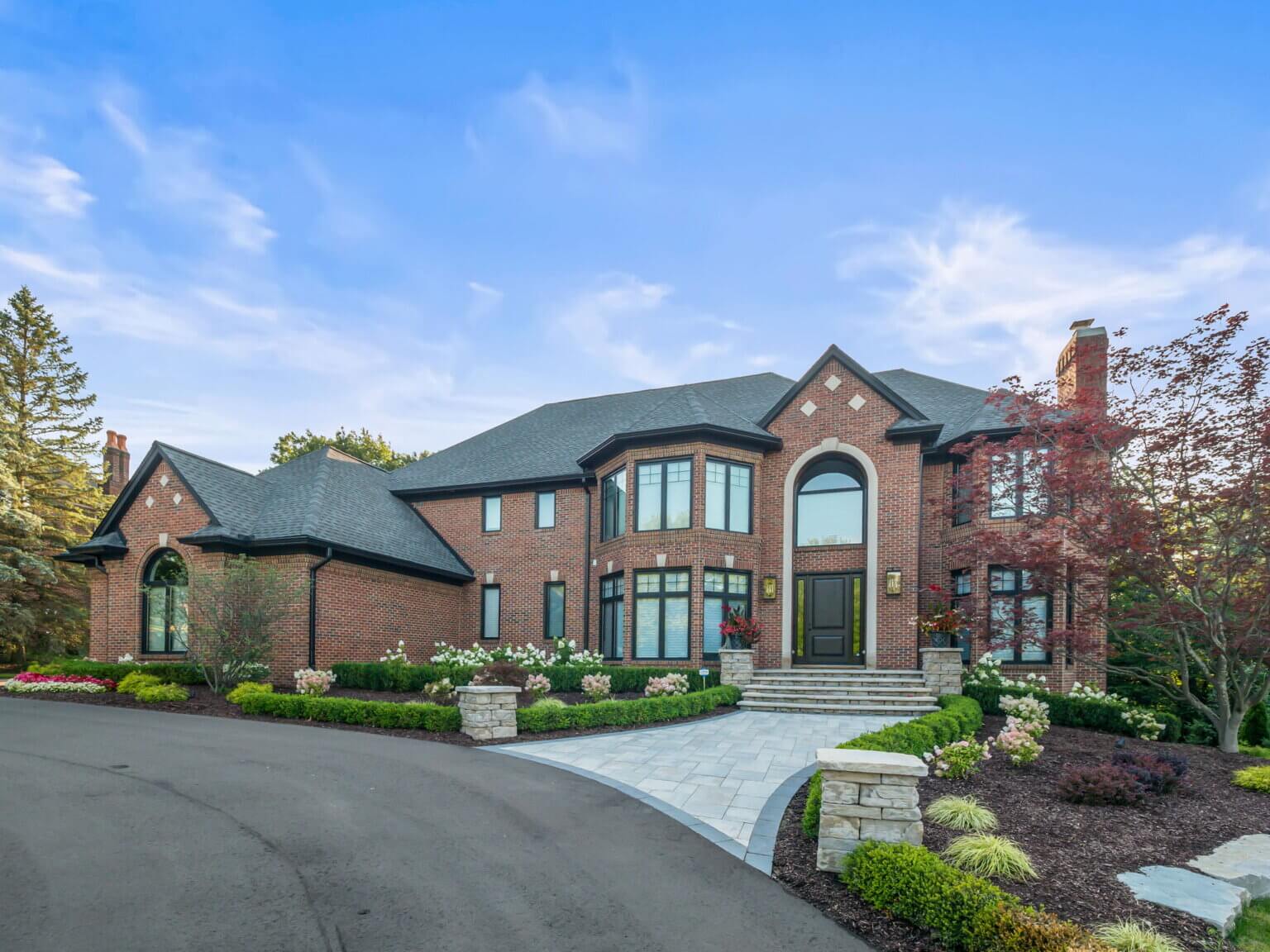 Front yard pavers Michigan Michigan front yard landscaping with pavers Front yard paving stones in Michigan Front yard hardscape design Michigan Michigan front yard patio pavers Front yard walkway pavers Michigan