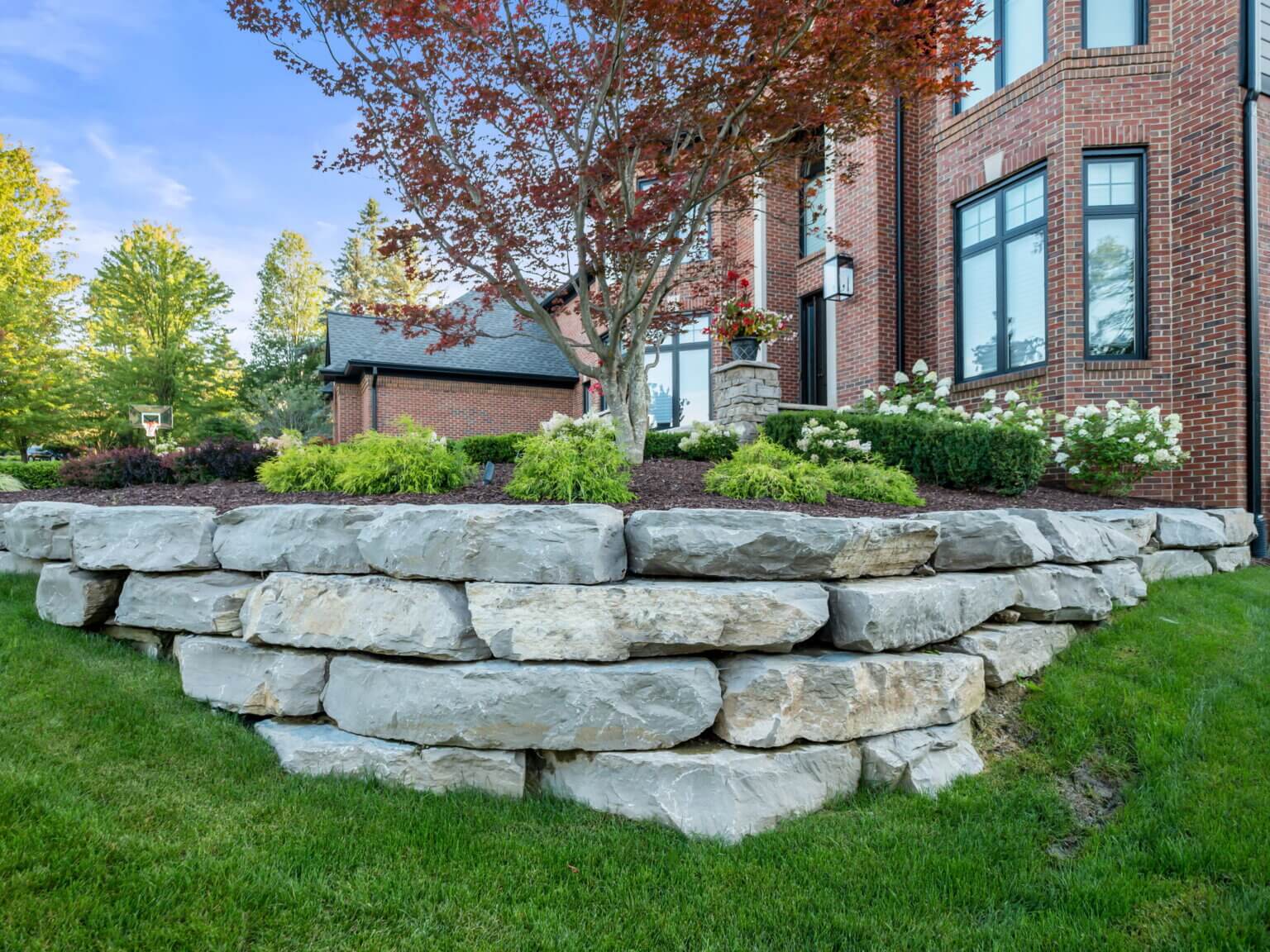 retaining wall landscaping rock near me green landscaping hard landscaping curb appeal landscaping tlc lawn care building raised garden beds patio pavers near me landscape management