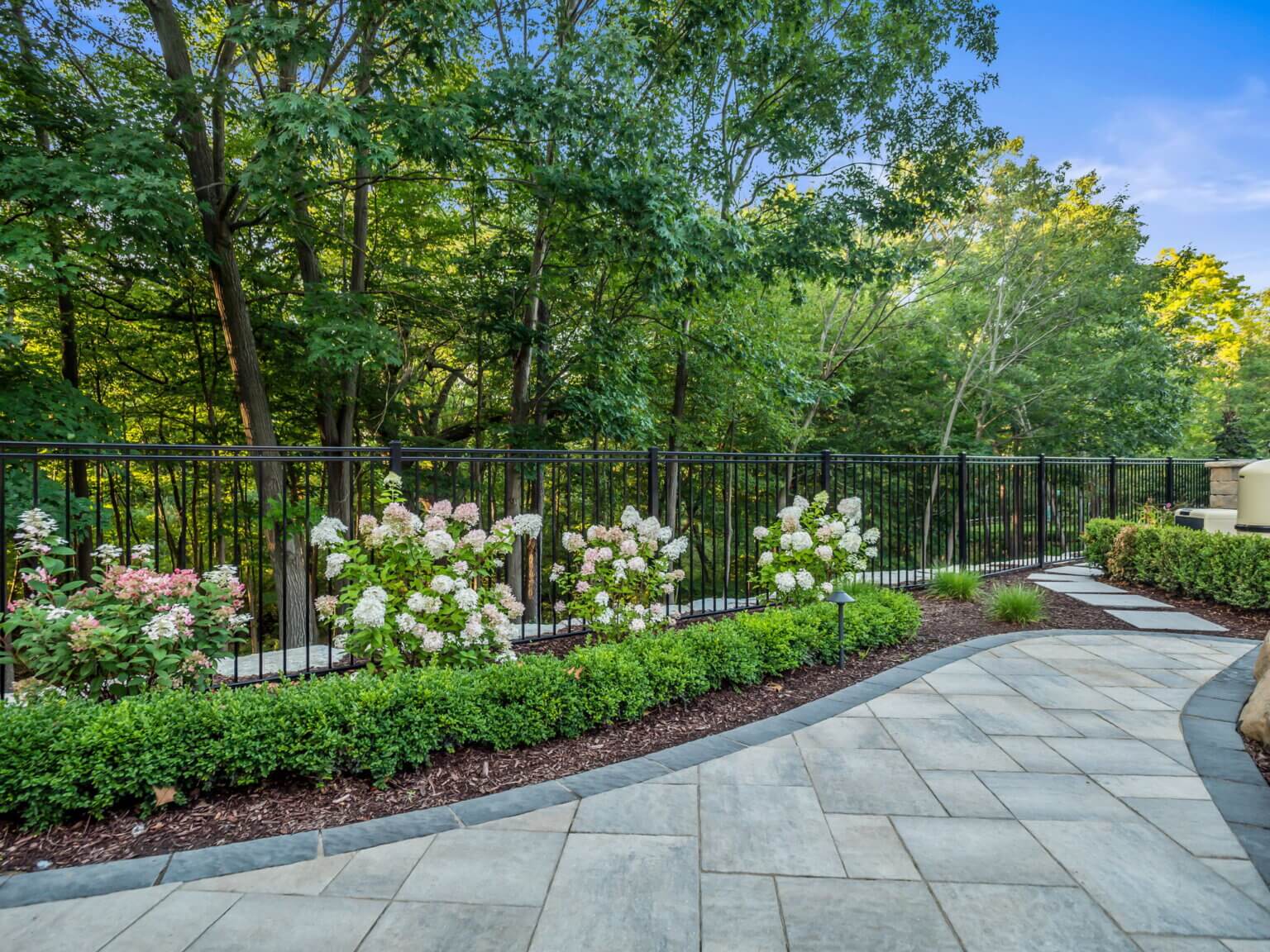 Front yard landscape design using pavers in Michigan frontyard shrubs frontyard softscape