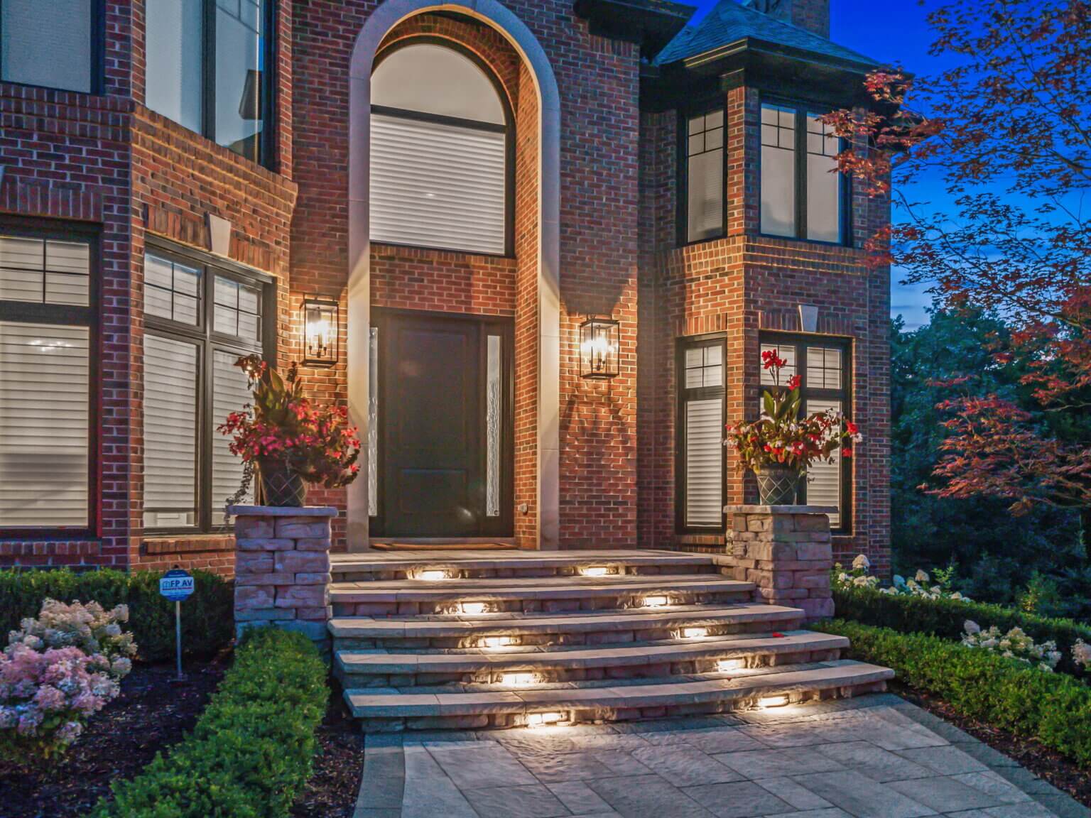 front yard paving stones in Michigan Front yard hardscape design Michigan Michigan front yard patio pavers Front yard walkway pavers Michigan Front yard paver installation in Michigan Michigan front yard brick pavers Front yard driveway pavers Michigan