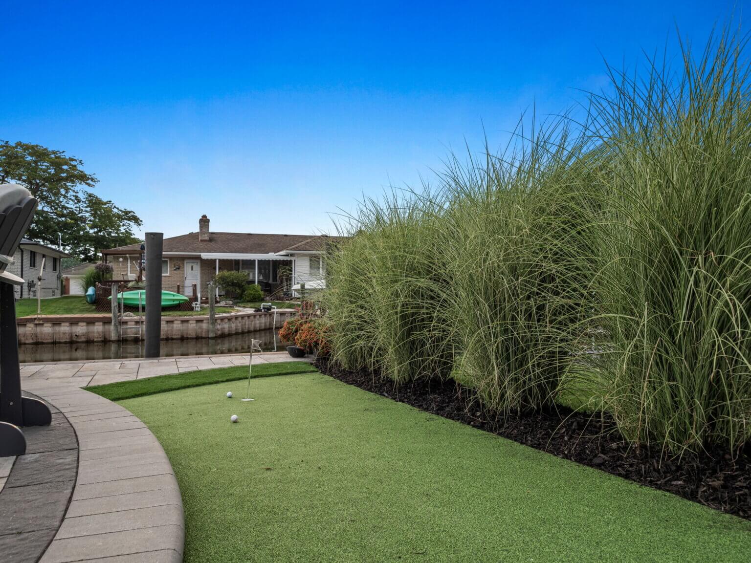 Artificial turf putting green landscaping near me, landscape design, landscaping companies near me, landscaping ideas, landscape architecture, landscape ideas, garden design, landscape design ideas, quality landscaping, landscapes pictures, stone pavers, brick pavers, unilock pavers in michigan, retaining walls, paver patio ideas, brick pavers, stone pavers in michigan, patio blocks, garden pavers michigan