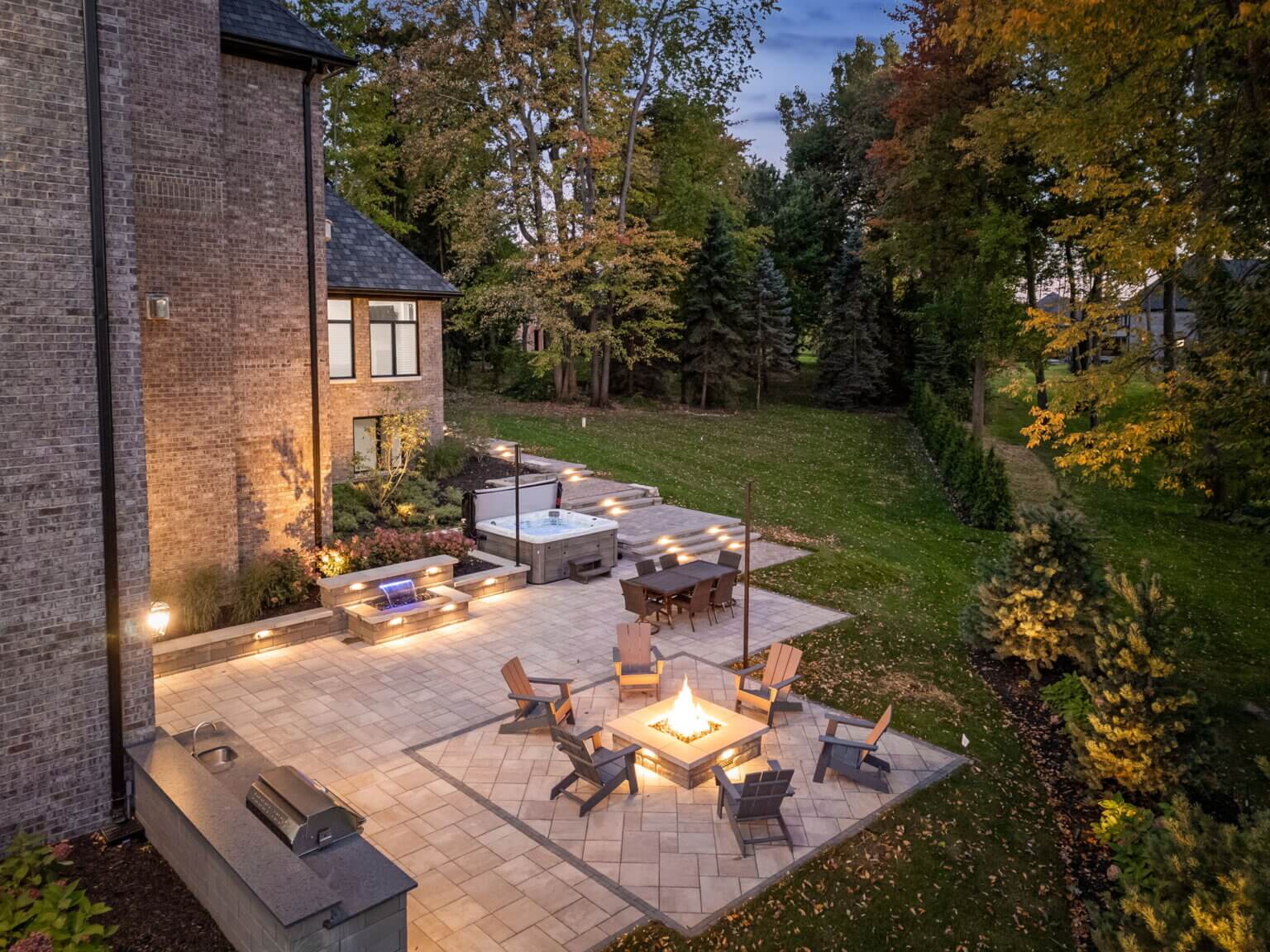 Michigan Landscape Design Landscape Design Services in Michigan Professional Landscape Design Michigan Michigan Landscape Architects Best Landscape Designers in Michigan Michigan Residential Landscape Design Custom Landscape Design Michigan brick pavers in Washington, MI front and backyard brick paver services front paver entrance paved backyard patio built-in grilling station custom waterfall feature Outdoor Fire Features Fire Pit Designs Fire Feature Ideas Gas Fire Pits Outdoor Fireplaces Fire Pit Installation Custom Fire Features