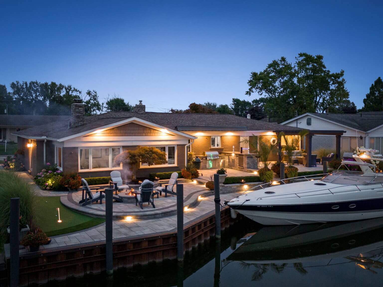 Complete front and backyard landscape Pergola Outdoor kitchen Wood burning fire pit Multi level paver slab patio along canal Brick paver walkway Michigan Landscape Design Landscape Design Services in Michigan Professional Landscape Design Michigan Michigan Landscape Architects Best Landscape Designers in Michigan Michigan Residential Landscape Design Custom Landscape Design Michigan Michigan Garden Design Landscape Planning Michigan Landscape Installation Michigan Michigan Landscape Renovation Sustainable Landscape Design Michigan Michigan Landscaping Ideas Michigan Hardscape Design Award-Winning Landscape Design Michigan Michigan Four-Season Landscape Design